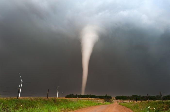 Image of a tornado crossing a plain.