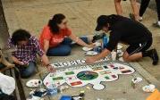 Students from the 全球 Student Friendship Center paint international flags on their crown. Photo Chuck Thomas/ODU